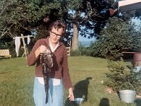 September 1968, Pinetta, FL "Mom looking at the 4 pound fish she caught. Taken in the back yard"