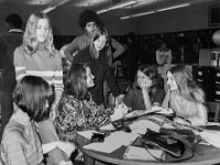 Susan took a picture for the yearbook of students in the school library