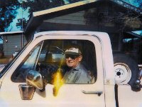 Van Hinton in his truck with Tuttles